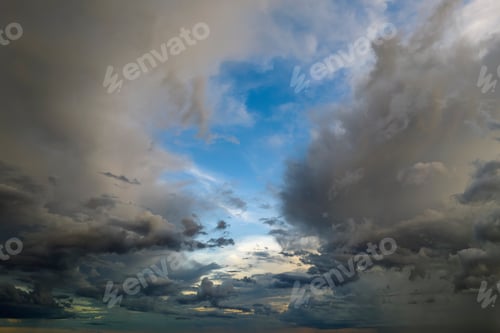 Preview: Cumulonimbus clouds forming before thunderstorm on evening sky.