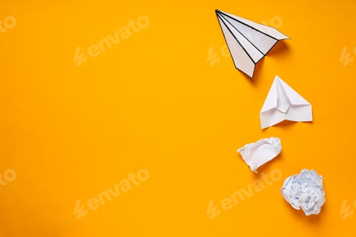 Preview: Business, startup and sponsorship concept with paper planes on yellow background