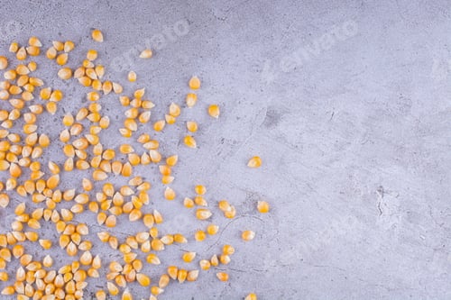 Preview: Corn kernels scattered on marble background