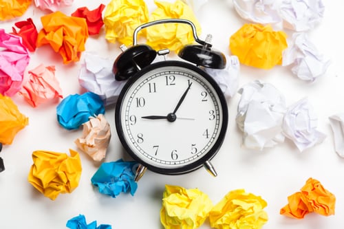 Preview: Alarm clock with crumpled paper balls.Timing and thinking idea concept