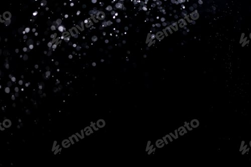 Preview: small drops of rain, snow on a black background. wind. Natural background