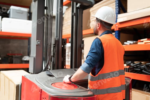 Preview: Supervisor Using Machinery At Warehouse