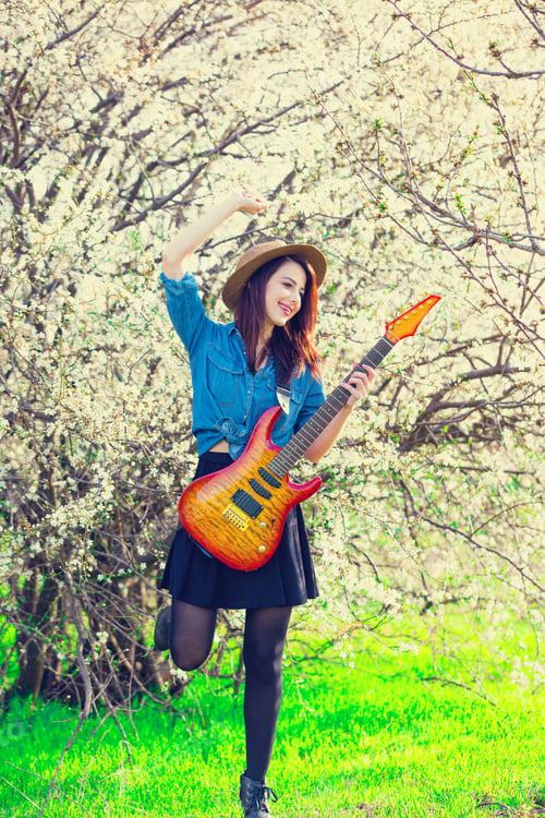 Preview: portrait of young woman with guitar