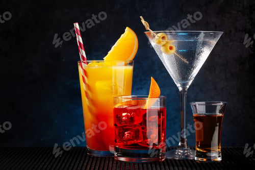 Assorted Colorful Cocktails on Bar Top With Garnishes