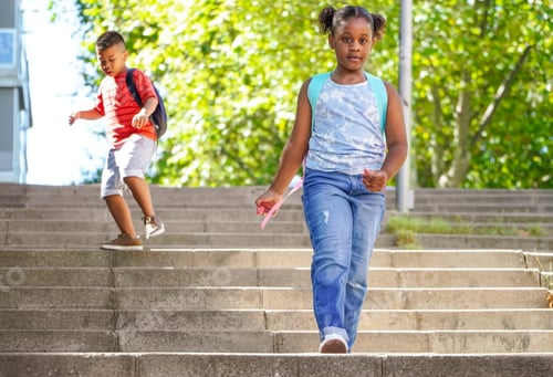 Preview: multiethnic kids with backpacks on the way to school.