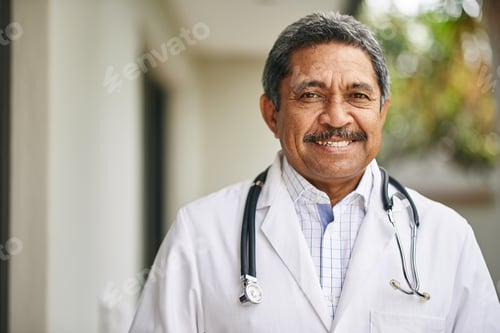 Preview: Happy to help you recover. Portrait of a mature male doctor standing outside.