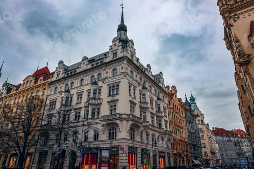 Preview: Historic architecture overlooking a bustling street in Prague during a cloudy afternoon