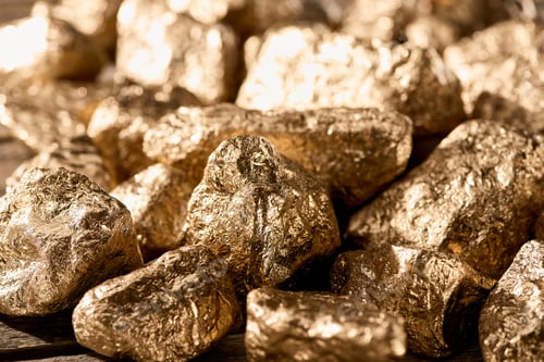 Preview: close up view of gold textured stones shining in sunlight