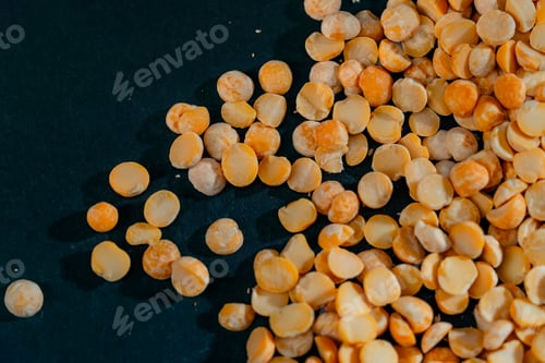 Preview: top shot close up yellow peas close-up lies on black and blue background Ukrainian culture, light