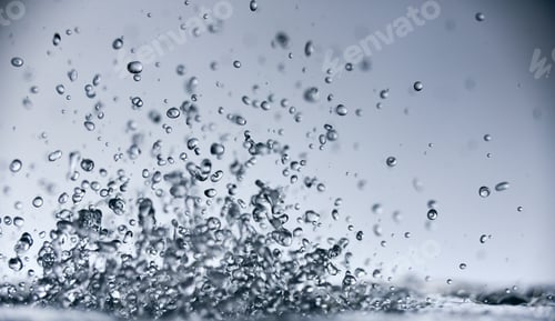 Preview: abstract falling drops of water on a light background close-up