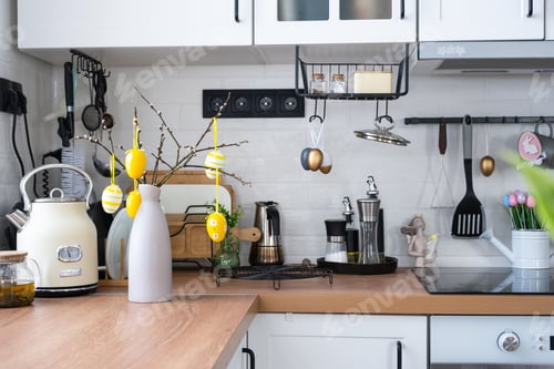 Preview: Interior of kitchen and details of decor of utensils with Easter decoration of colorful eggs in a lo
