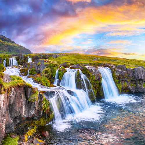 Preview: Fantastic view on Kirkjufellsfoss waterfall near Kirkjufell mountain at sunset