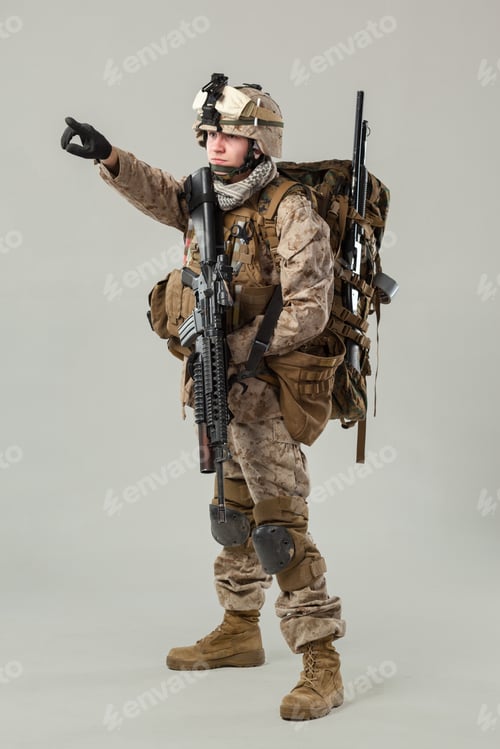 Preview: Soldier directs actions during training in a military facility at noon