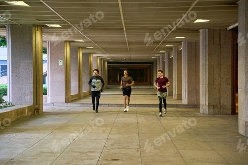 Preview: Three men running in a modern city passageway