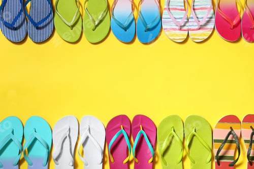 Preview: Different flip flops and space for text on yellow background, flat lay. Summer beach accessories