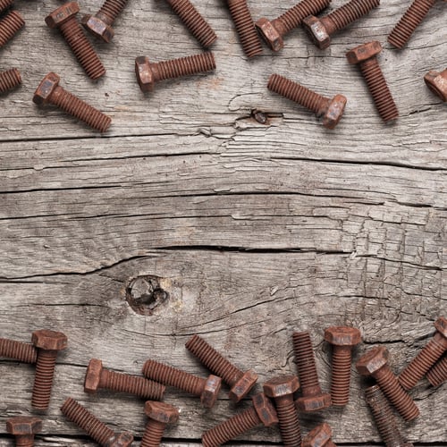 Preview: Rusty Screw Bolt On The Wooden Table