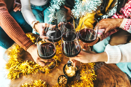 Preview: Happy people celebrating new year eve toasting wine glasses together