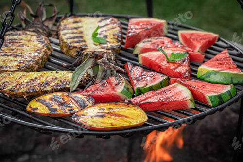 Preview: Homemade grilled watermelon and pineapple in the summer garden.