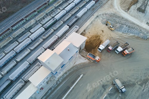 Preview: Aerial view of cargo train loaded with crushed sandstone materials at mine factory. Railway