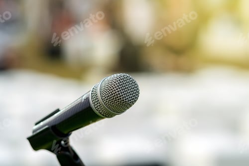 Preview: Microphone on the stage over the Abstract blurred photo of another music equipment