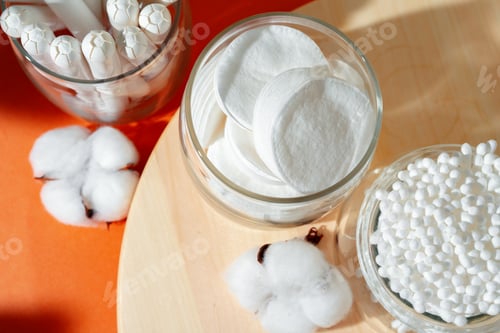 Preview: Cotton tampons and ear buds on paper background