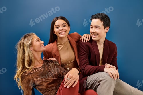 Preview: joyous brunette teenage girl in elegant attire looking at camera next to her diverse friends