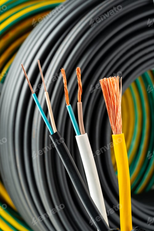 Preview: Closeup of Stripped Electrical Wires Against Rolled Cable