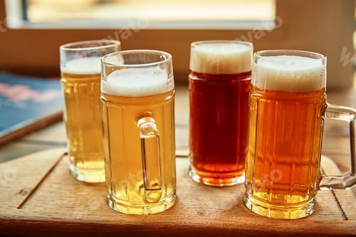 Preview: Set of four glasses with different kind of beer on the table