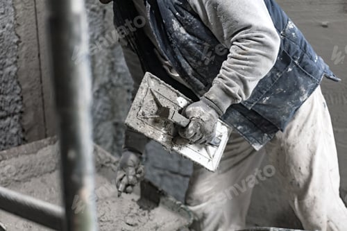 Preview: Real Construction Worker Working On A Wall Inside The New House.