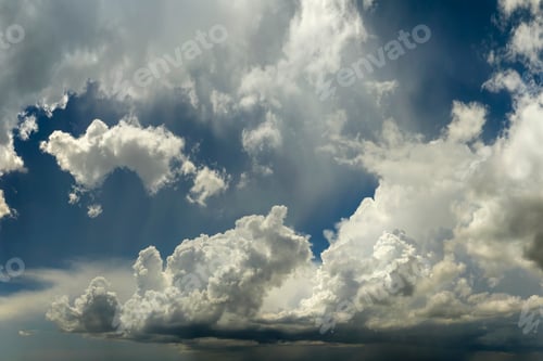 Preview: Bright landscape of blue sky with flying white clouds.