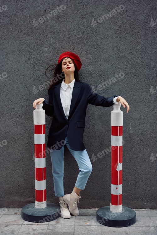 Preview: Fashion woman standing on the street in front of the city and road works tourist in stylish clothes