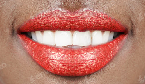 Preview: Mouth of African woman with red lips and shining white teeth