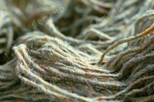 Preview: Threads of natural organic sheep wool. Unwound skein of olive green knitting yarn.