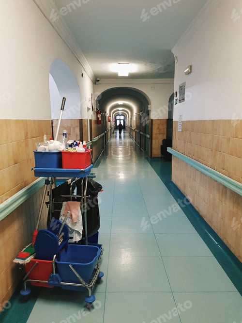 Preview: A cleaning trolley in a long hallway.