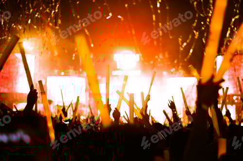 Preview: Crowd Engaged in Concert with Lights and Confetti