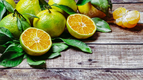 Preview: Green mandarins on wooden background, copy space