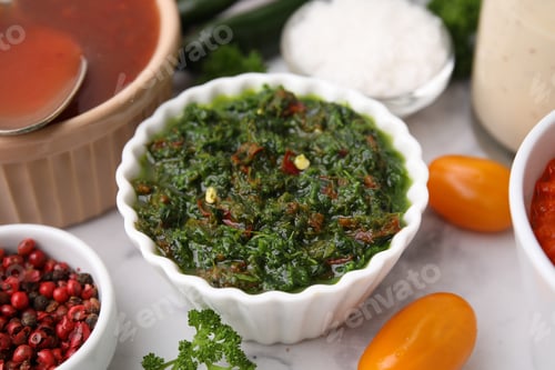 Preview: Fresh homemade marinade in bowl on table, closeup