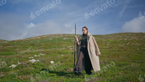 Preview: Travel girl exploring mountain walking grassy hill. Serene lady admiring nature