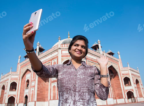 Preview: Young girl taking Photos in front of Humayun's Tomb, Delhi, India.