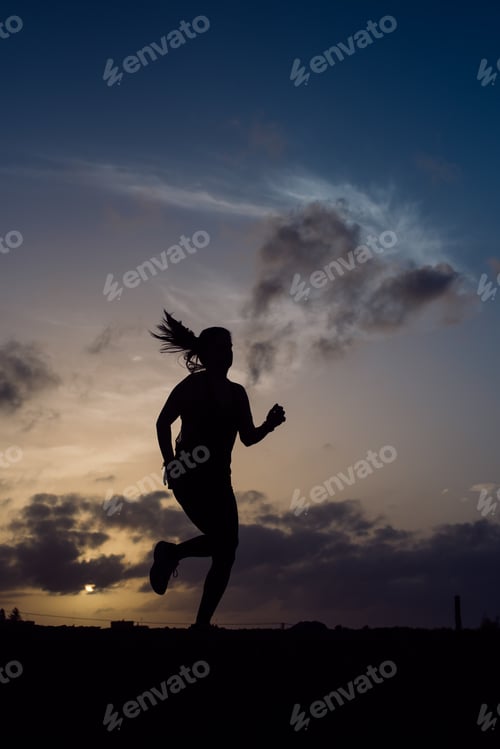 Preview: Jumping woman and sky with clouds at sunset