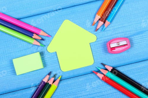Preview: School accessories and shape of building on blue boards, copy space for text