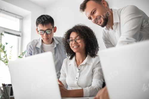 Preview: Black manager explaining project to colleagues
