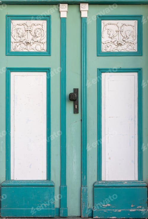 Preview: Mint doors with white stucco on historic facade. Turquoise decorative doors.