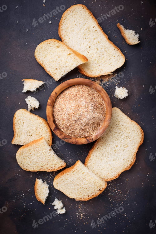 Preview: Bowl of breadcrumbs and slices of a loaf
