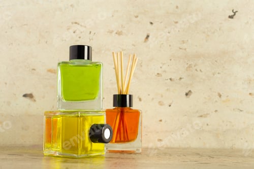 Preview: Colorful glass bottles with fragrance oils and reeds displayed on a rustic surface
