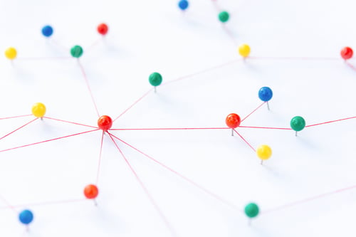 Preview: The connection between the two networks. Network simulation on paper linked together by yarn