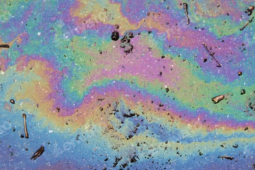 Preview: Picture of an oil spill on asphalt. Rainbow colors.