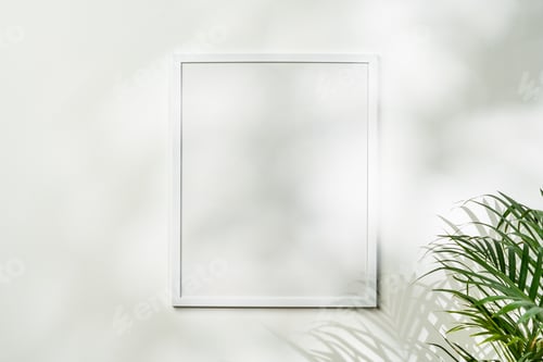 Preview: White wooden photo frame with plant leaves on white background