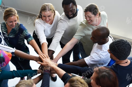Preview: Diversity teamwork with joined hands