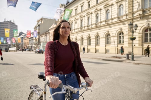Preview: One Young Woman, Looking Forward, Pushing Her Bicycle In City, Pedestrian Zone (European Old
